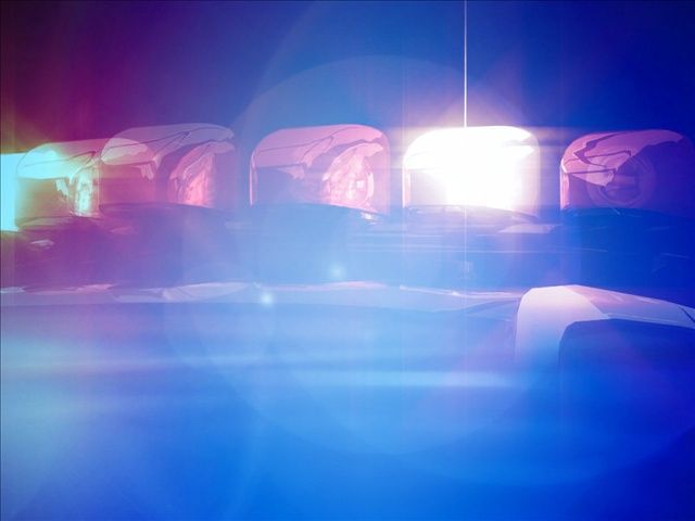 Roads are barricaded after car crashes into utility pole, police say