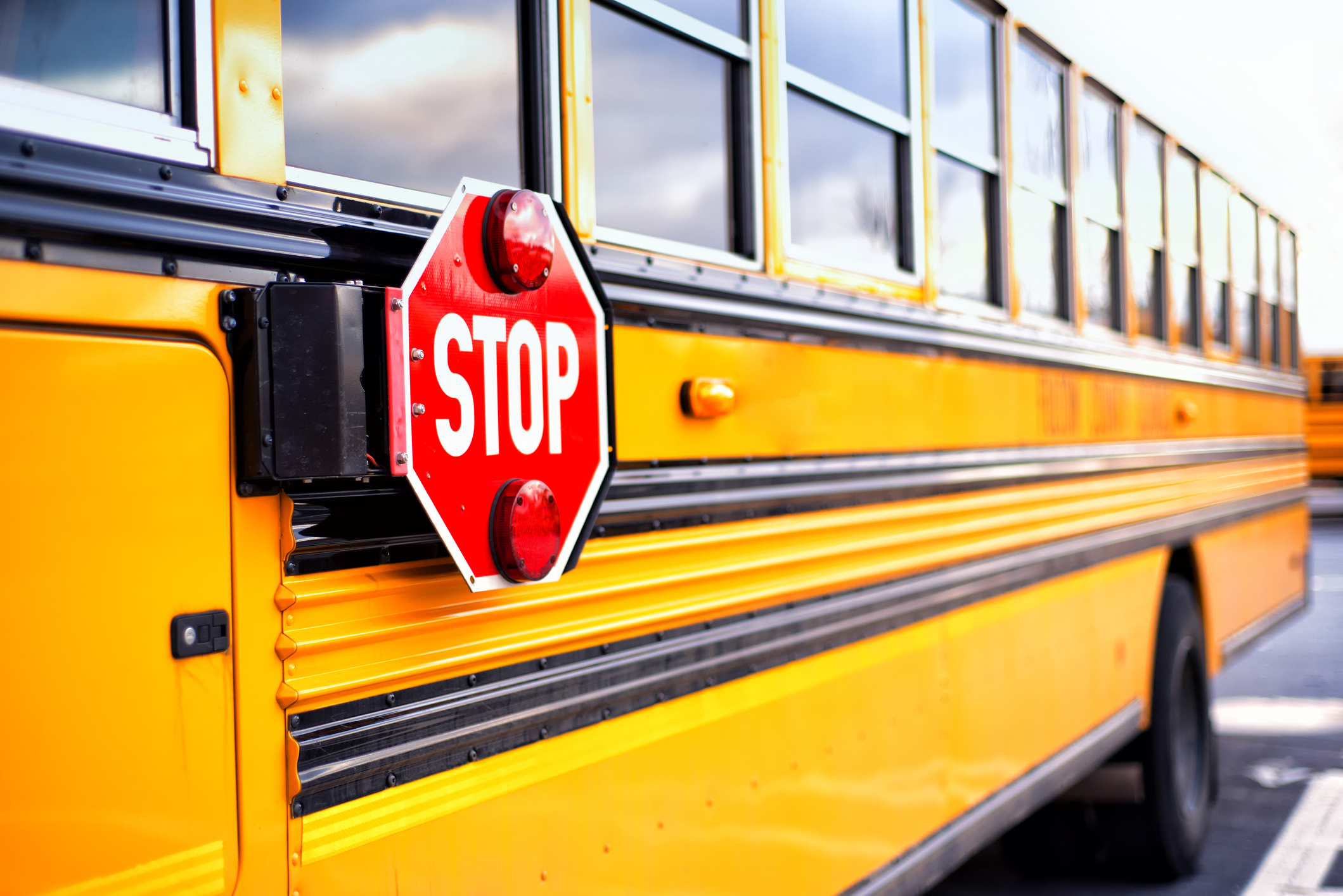 Car crashes into school bus on Highway 64