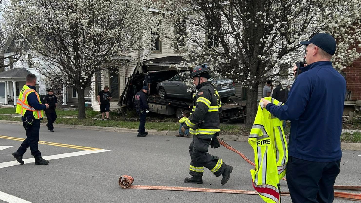 Tow truck hits vehicle, slams into house in Lebanon