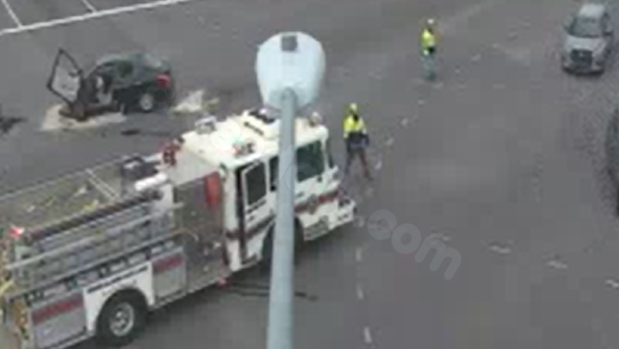 At least 1 injured in 2-car crash; Intersection blocked