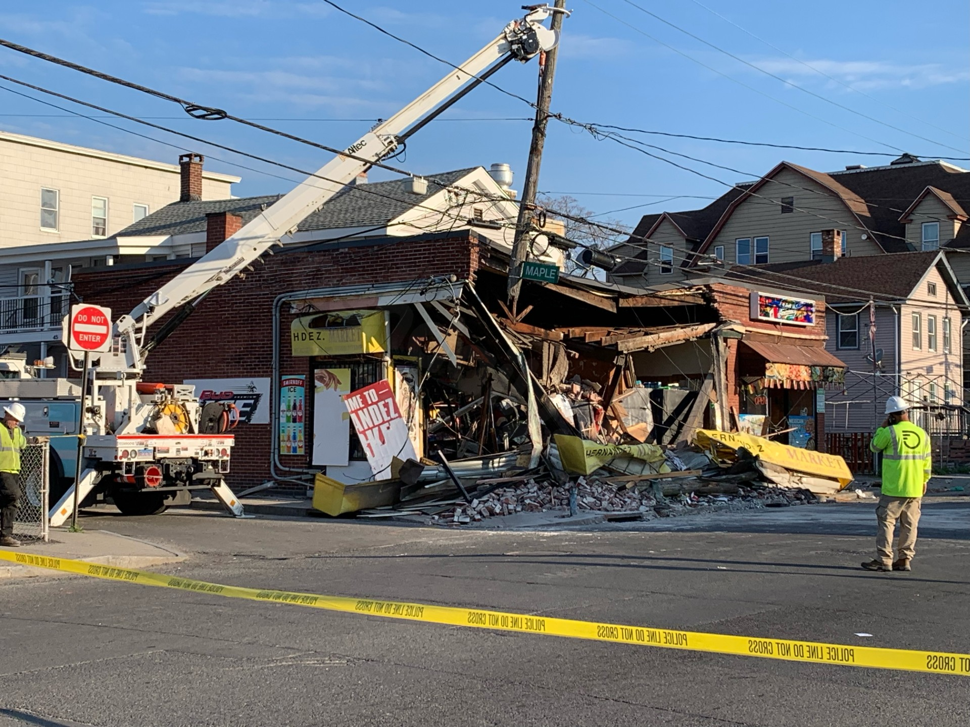 4 dead after car crashes into Waterbury building causing partial collapse