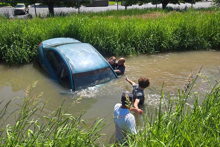 Rescuers jump into canal to save surprised Idaho woman from car accident