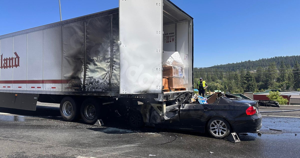 Car ignites following crash with large truck on Grass Valley road