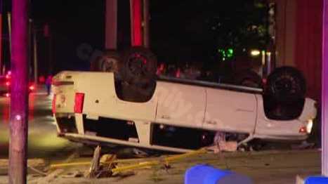 Vehicle flips, crashes into power pole; no injuries reported
