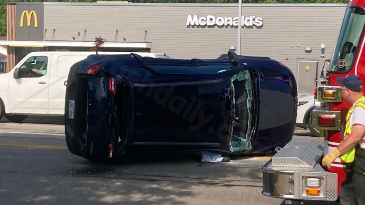 Car overturns after collision in Liberty.