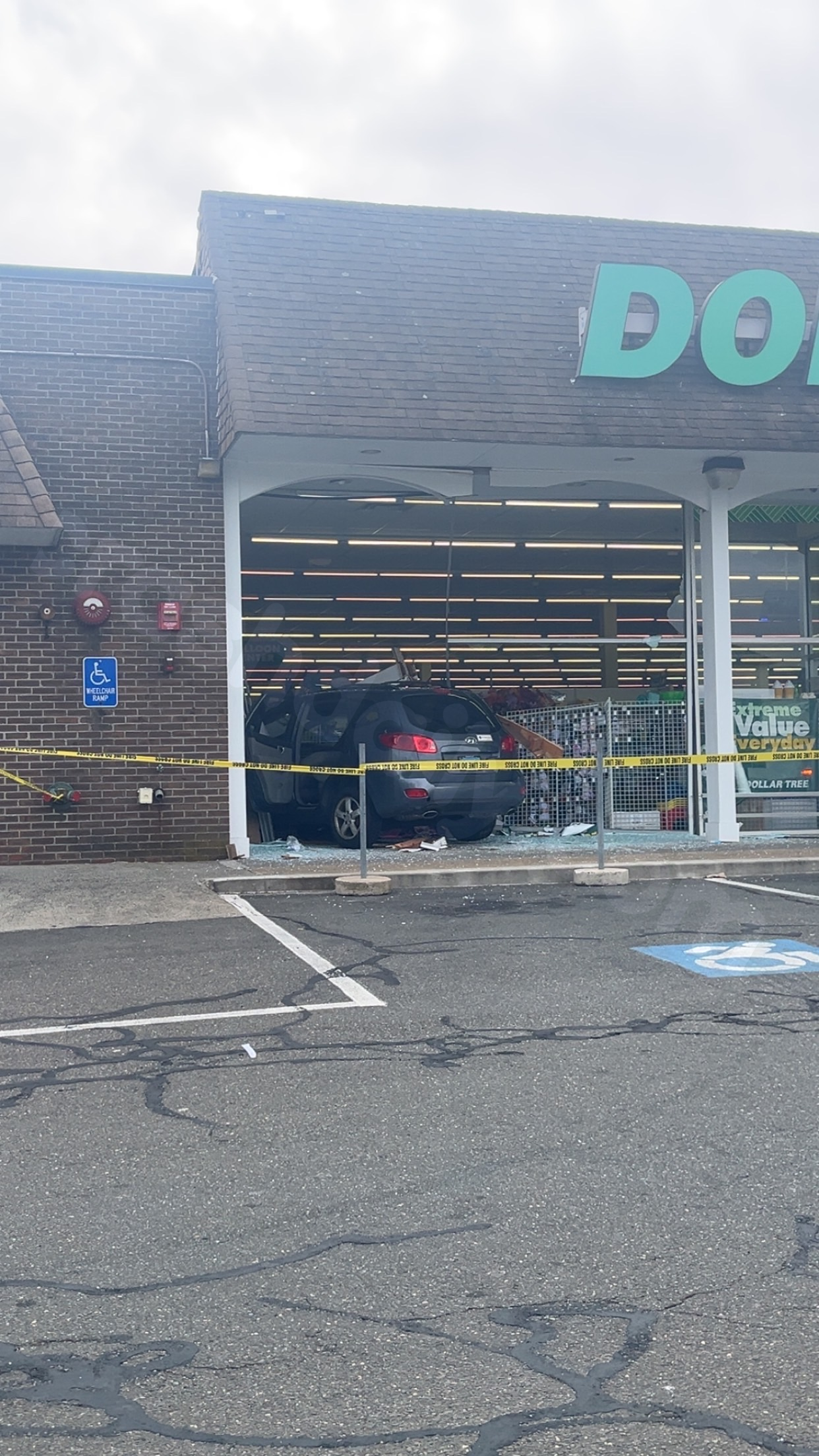 Vehicle smashes into Branford Dollar Tree window