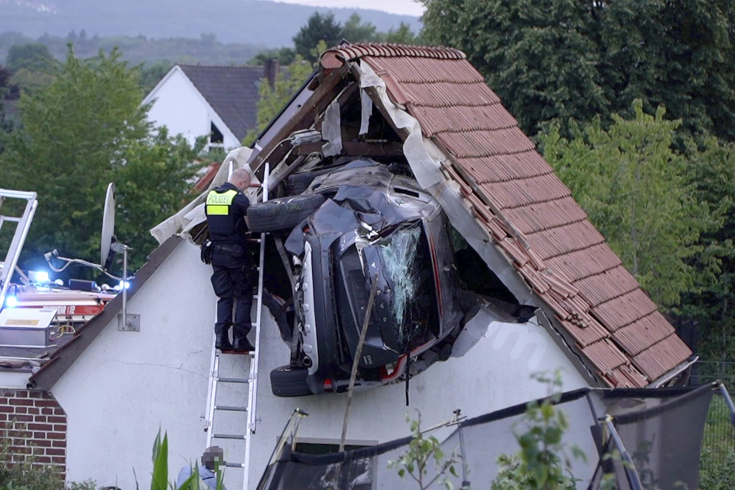 Car collides with barn roof in Germany, causing serious injuries to 2 individuals