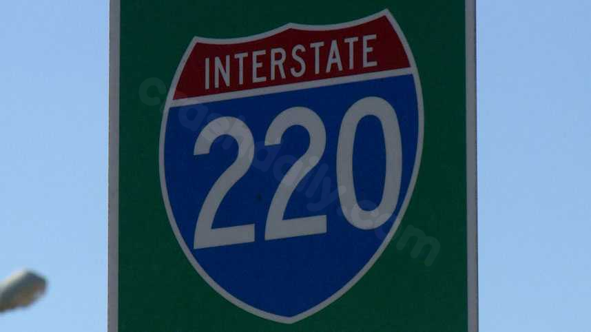 Car on I-220 shot at, crashes; occupants survive, suspect at large