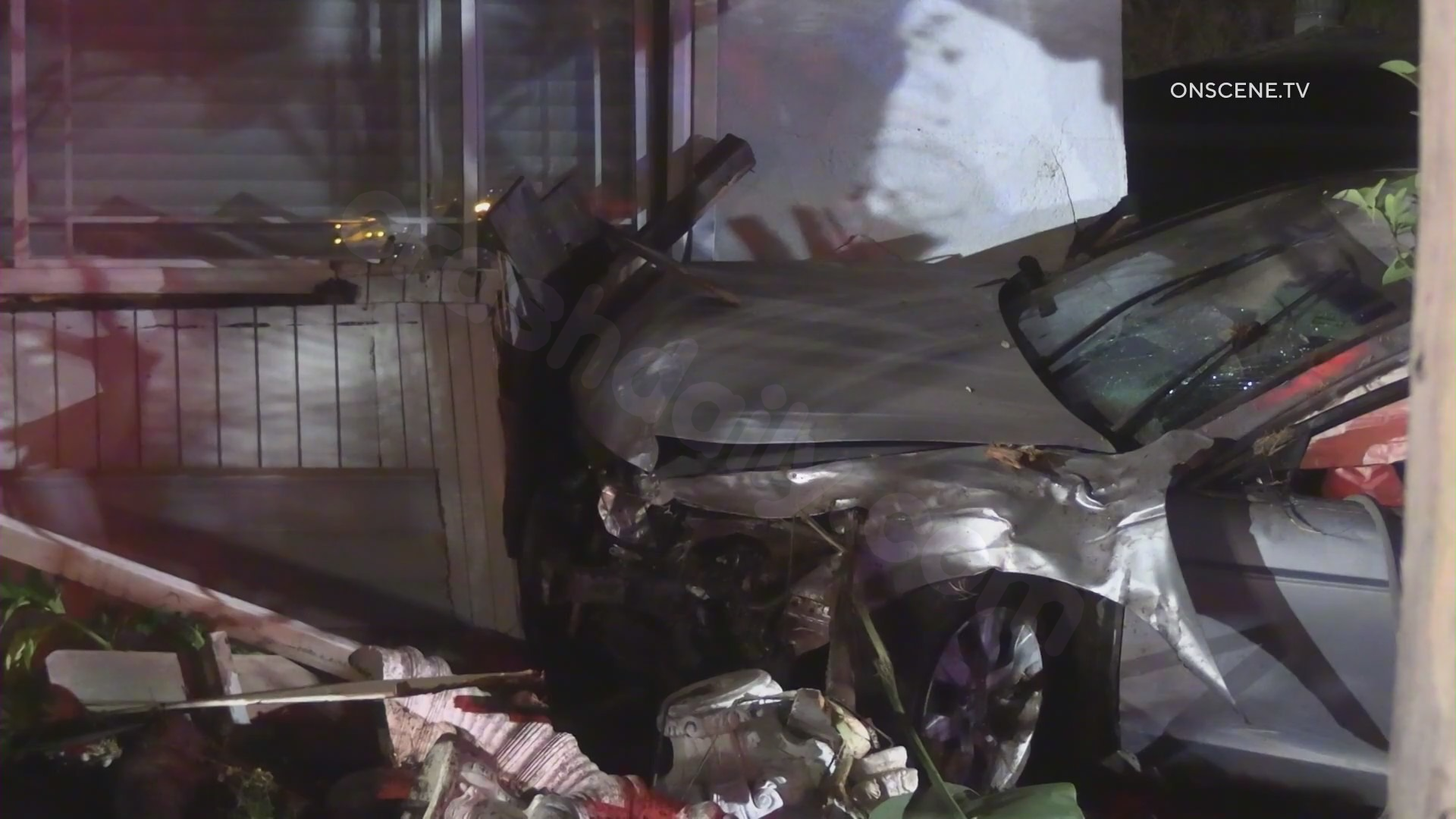 Speeding vehicle crashes into homes in Huntington Beach at night