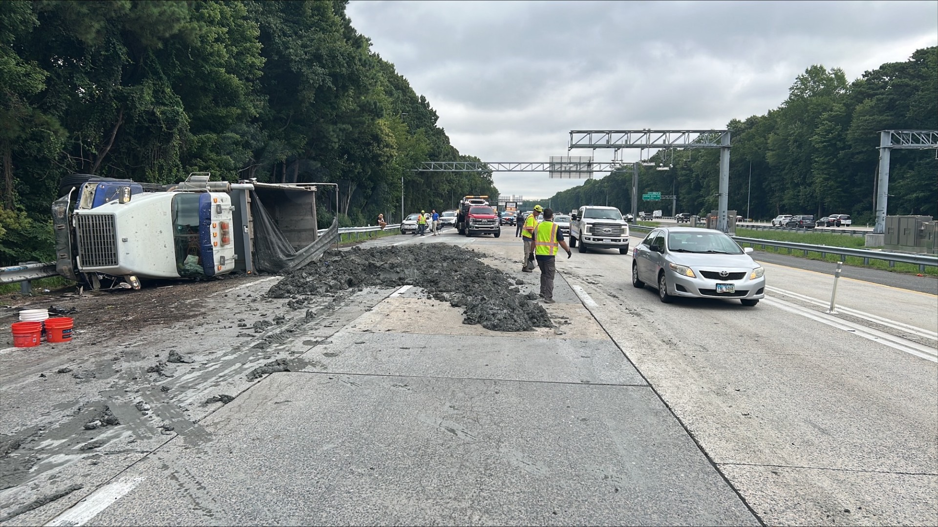 Dump truck flips over after multi-car accident near Greenbrier Parkway