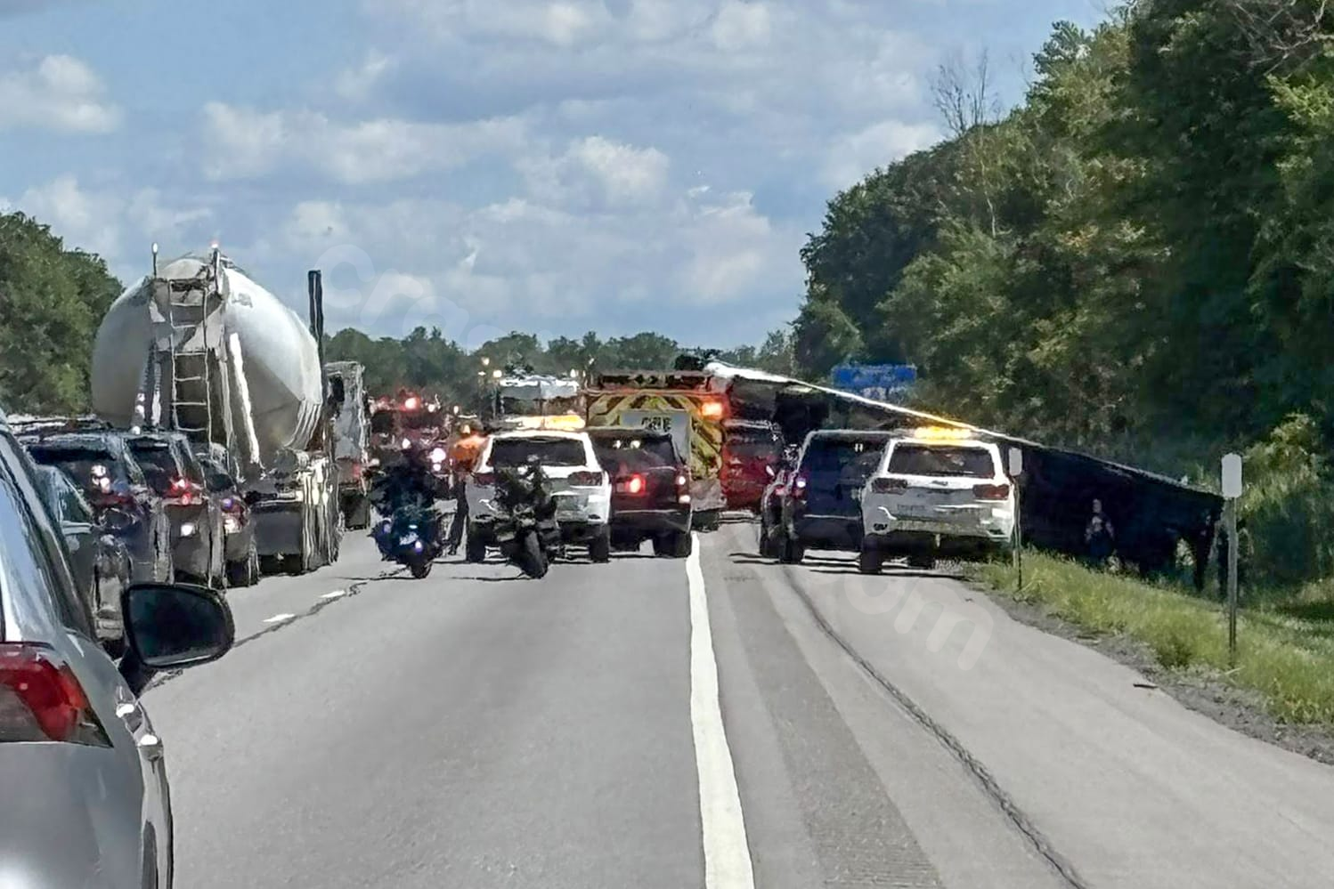Deadly tour bus crash in western New York leads to road closure.