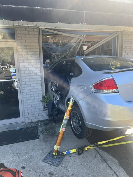 Image: Vehicle collides with Newtown building, individual rescued