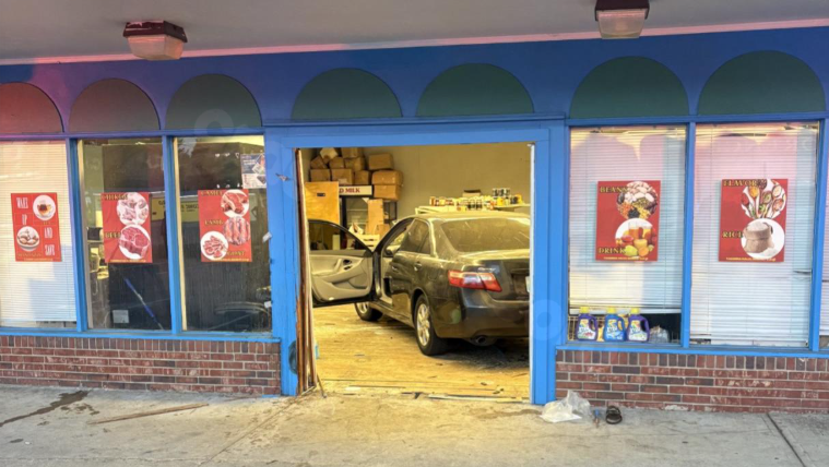 Woman fatally trapped under car after it crashes into Florence grocery store