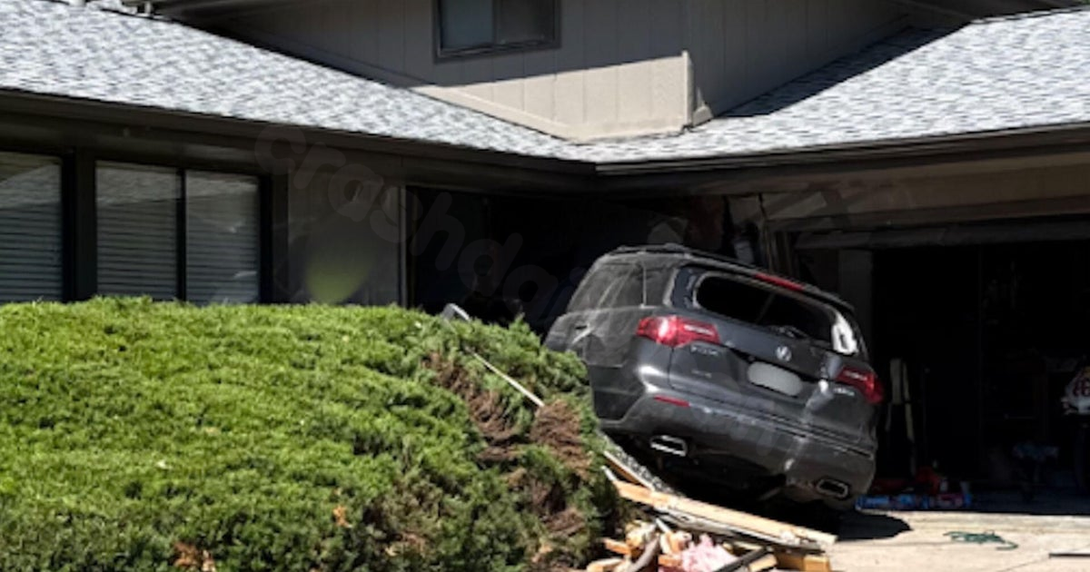 Colorado man crashes car into two homes, attempts to run over woman