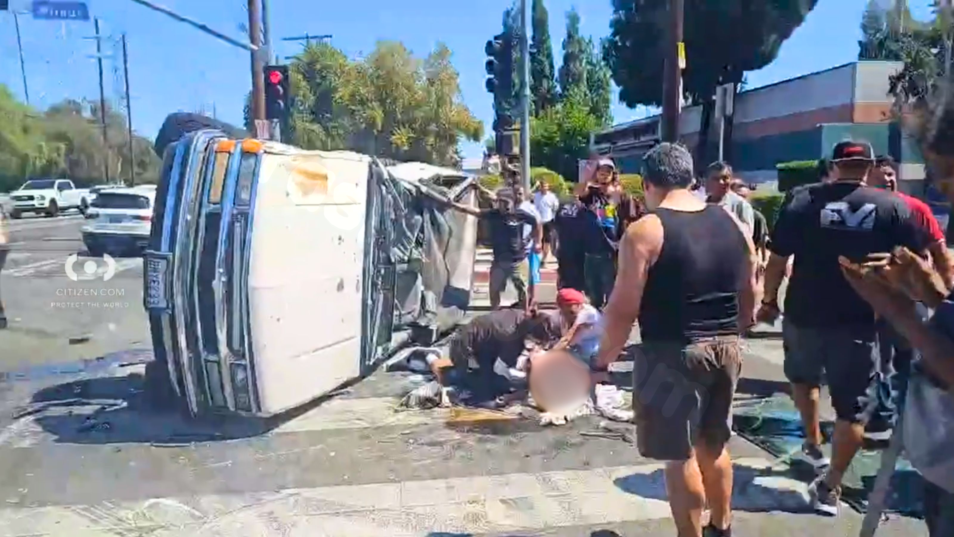 Video shows people assisting injured man from car crash