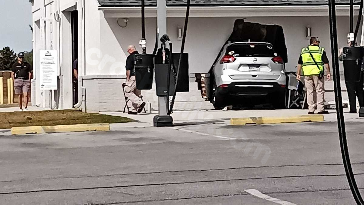 SUV crashes into car wash, creating a gap in the wall