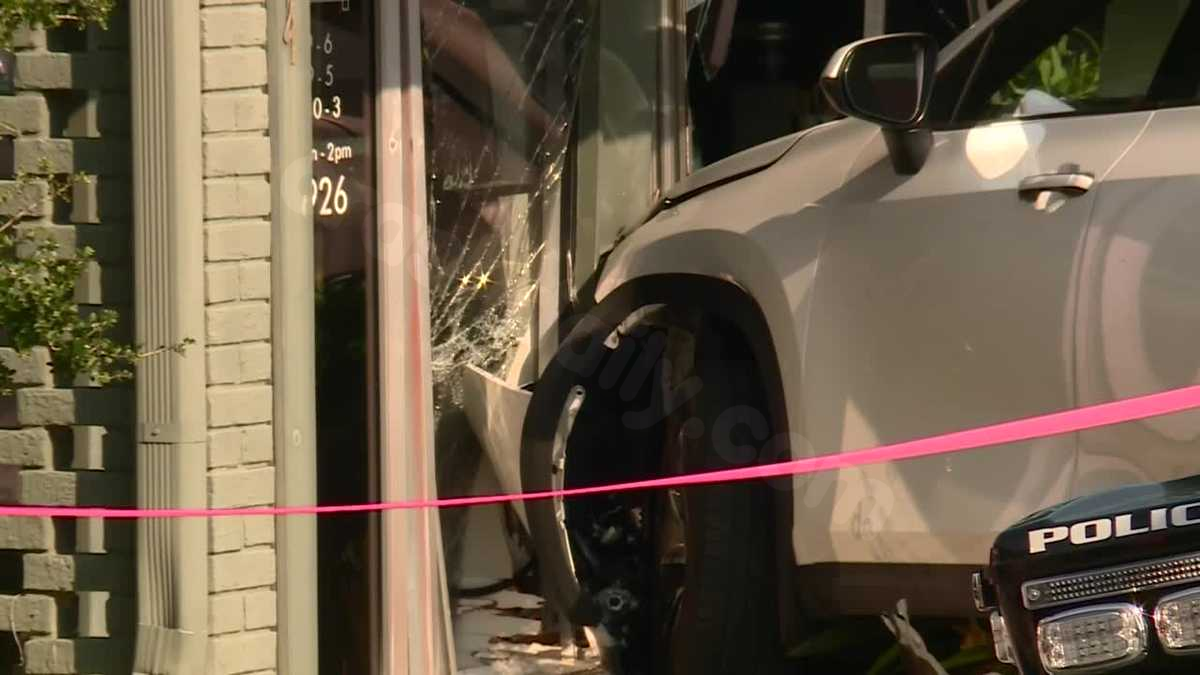 Driver hospitalized following car collision with Homewood salon.