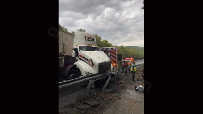 Traffic disruption caused by collision between cattle truck and emergency vehicles on I-26.