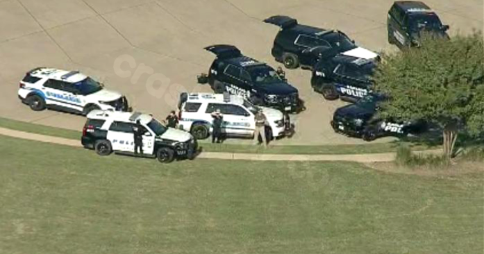 Police look for suspects in wooded area near Garland-Sachse line post robbery and crash.