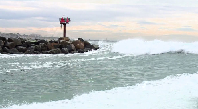 Boat overturns in Oceanside Harbor during rough surf