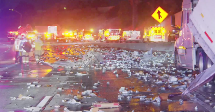 Beer cans scattered on westbound 210 Freeway in Azusa post semi-truck collision.