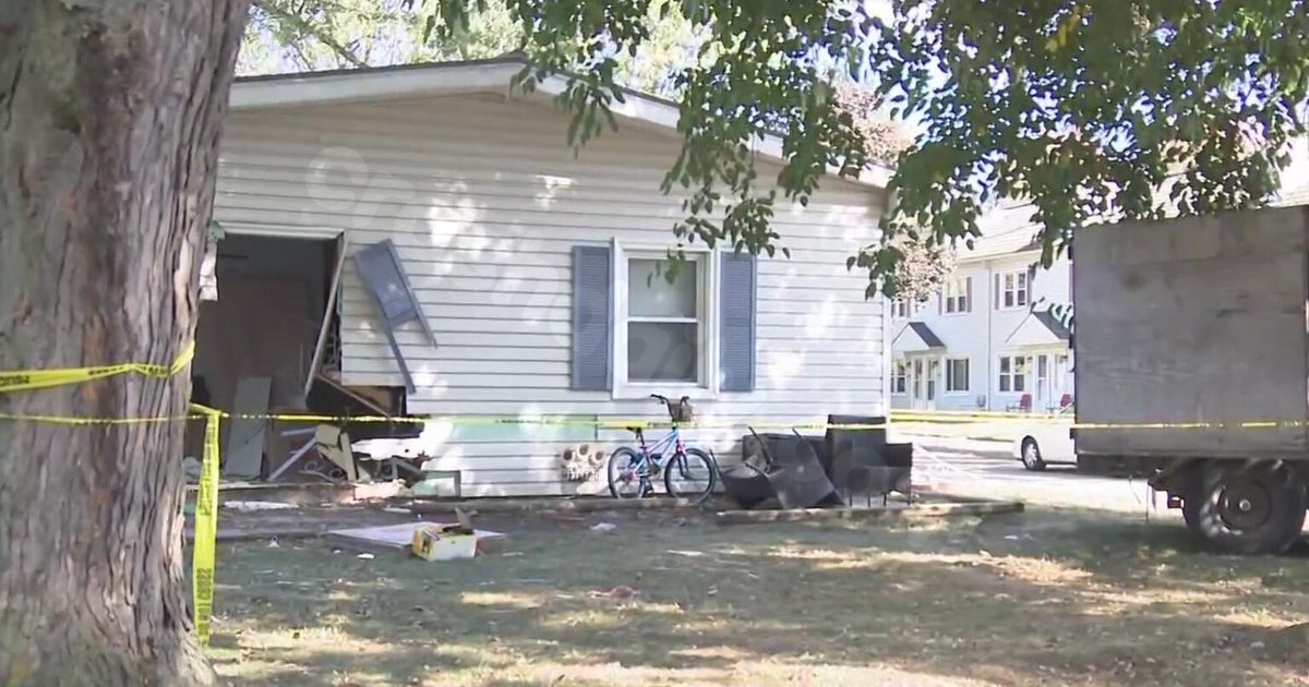 Girl, 9, hurt when car collides with house near Detroit