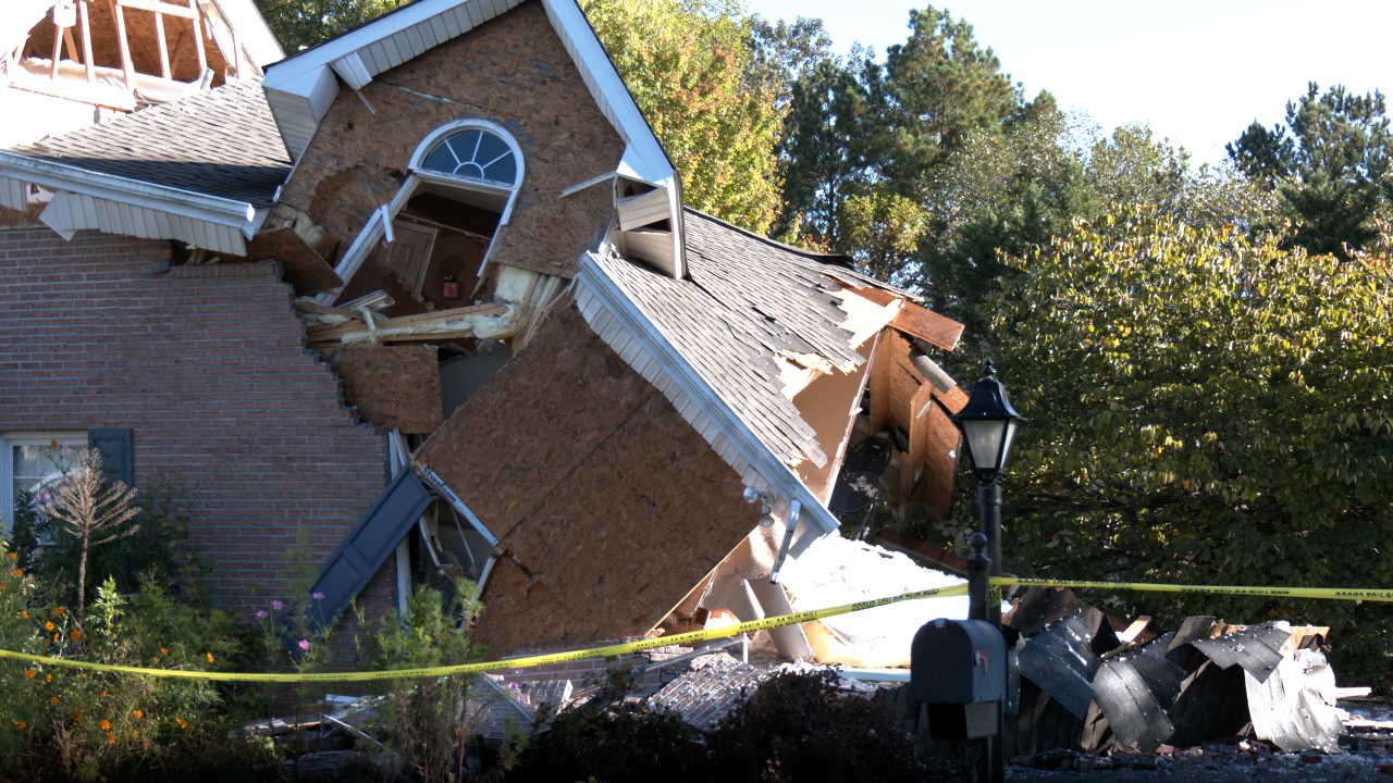 Teen charged in Powell after car slams into home