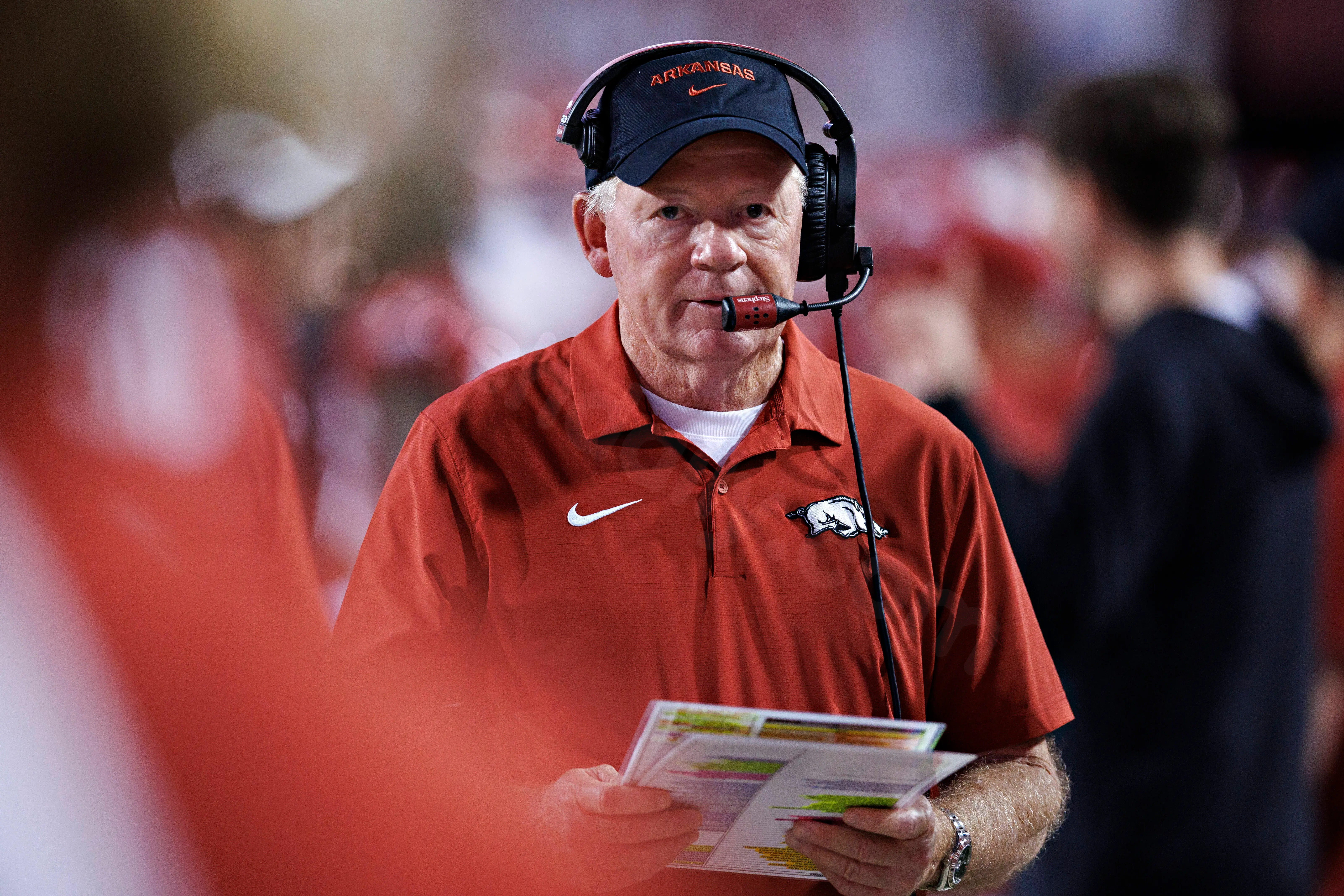 Explanation of Bobby Petrino's situation after accident and viral photo of injuries.