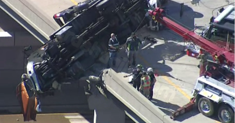 Rescue in progress for semi-truck hanging over McKinney overpass