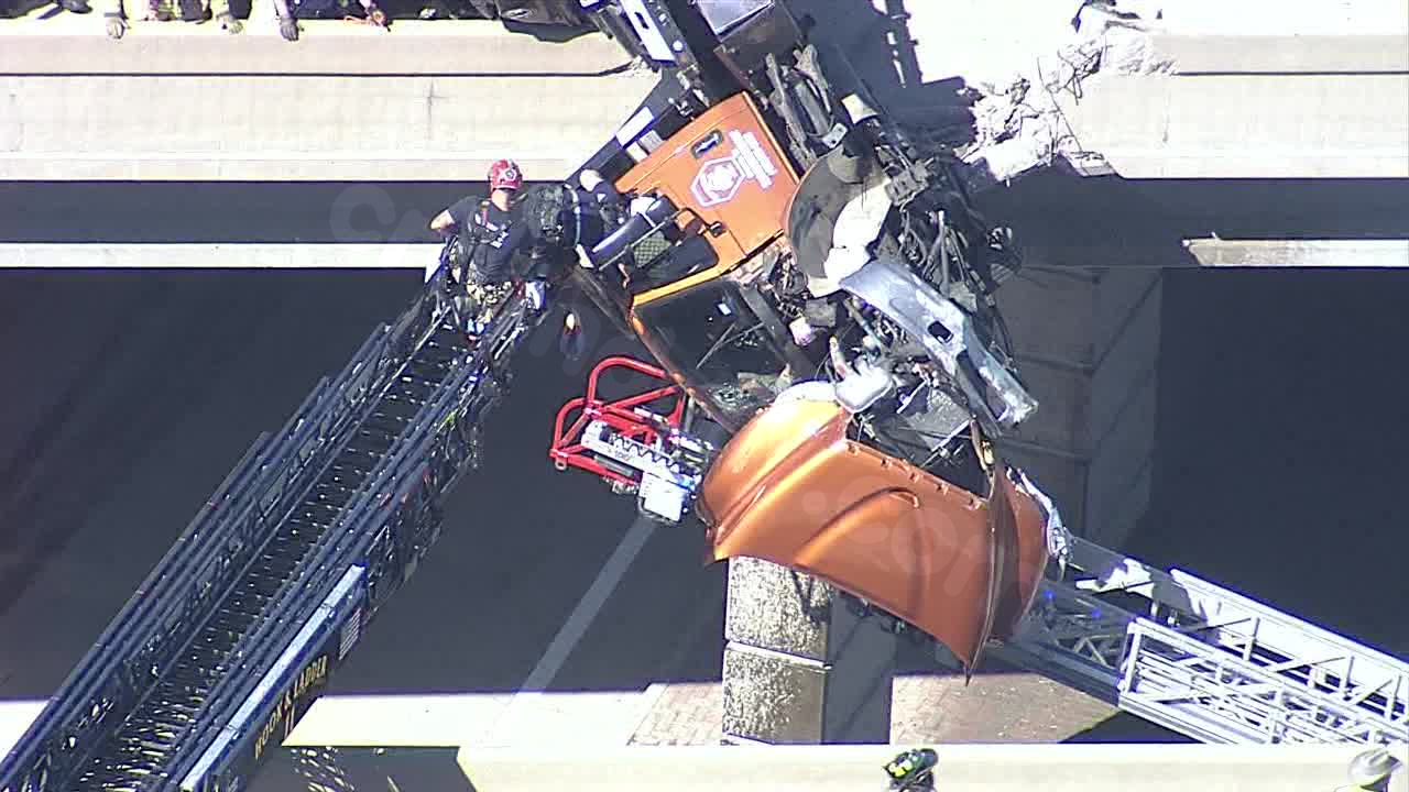 Rescue of tow truck driver dangling from McKinney overpass