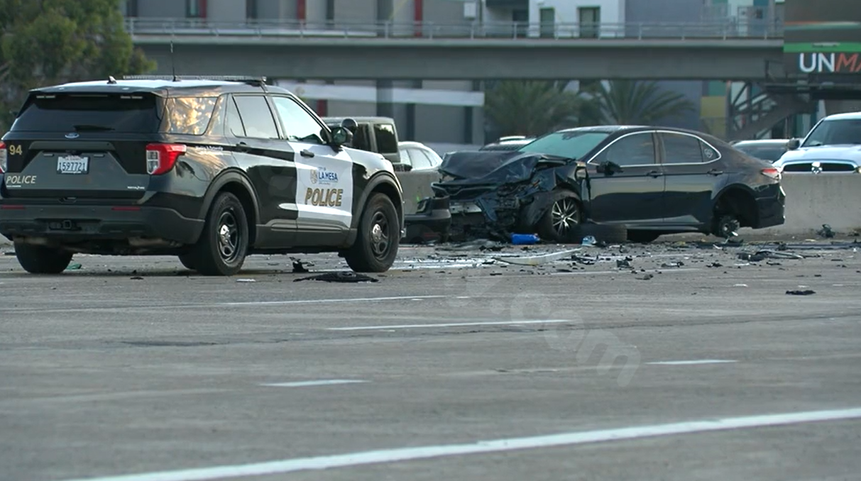 Driver arrested for causing fatal collision with police officer and another person.