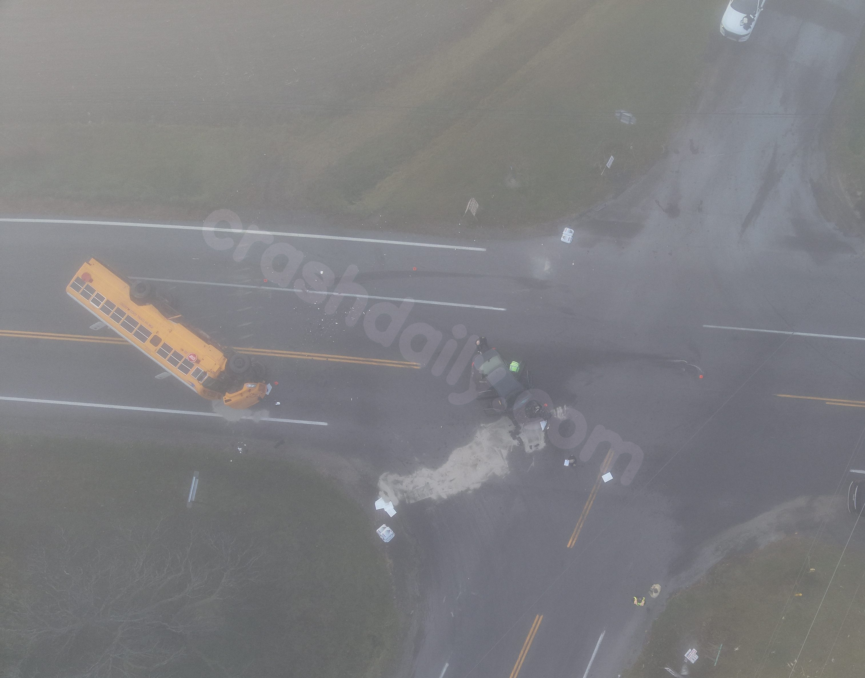 School bus flips over following crash with unmarked Sheriff's vehicle