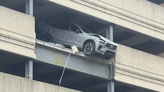 Vehicle partially dangling from UPMC hospital parking structure after hitting barrier