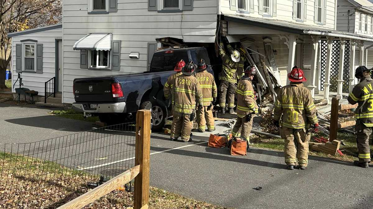 Pickup truck collides with home after crash