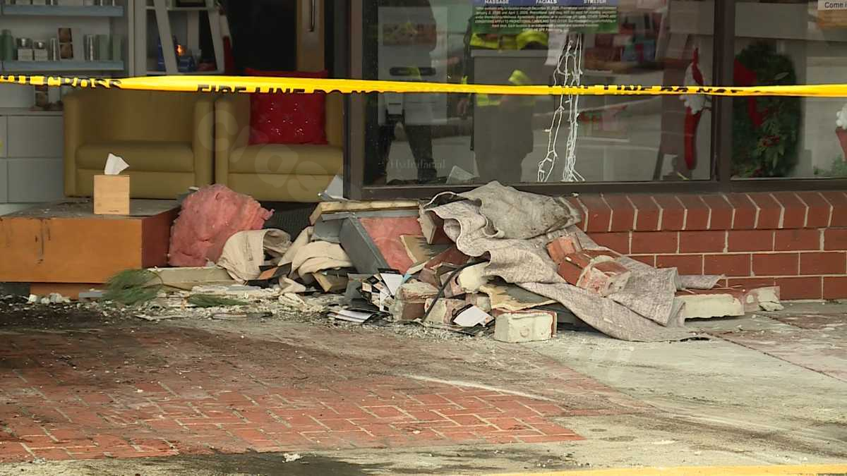 Vehicle collides with South Portland store, lands in entrance