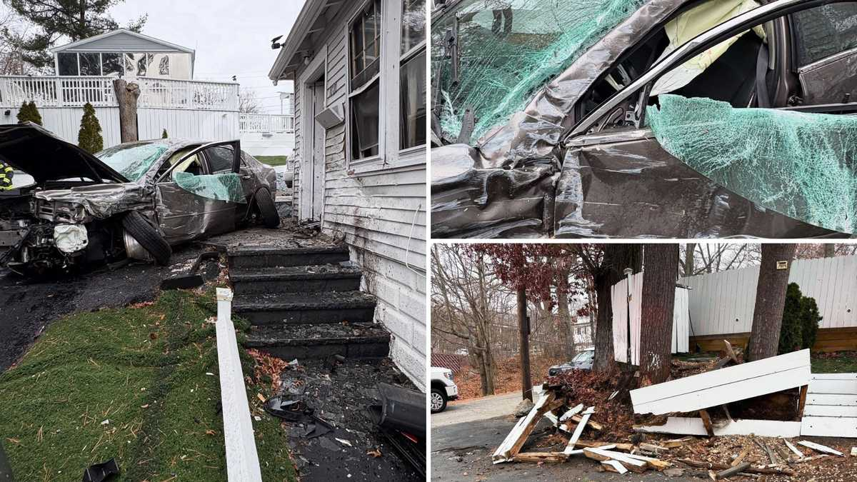 Driver stuck in car after collision with house in Massachusetts