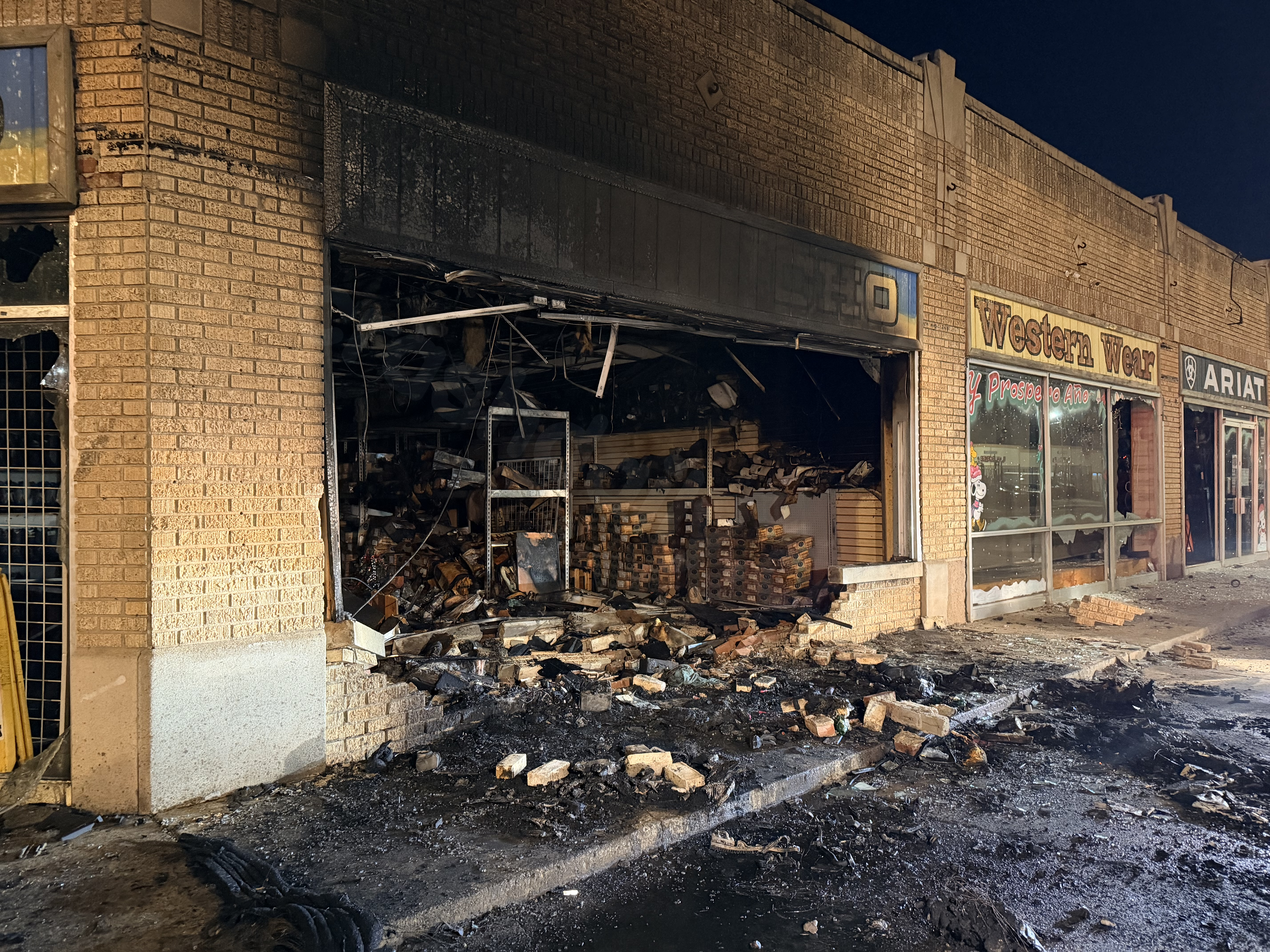 Fatal car collision causes building fire