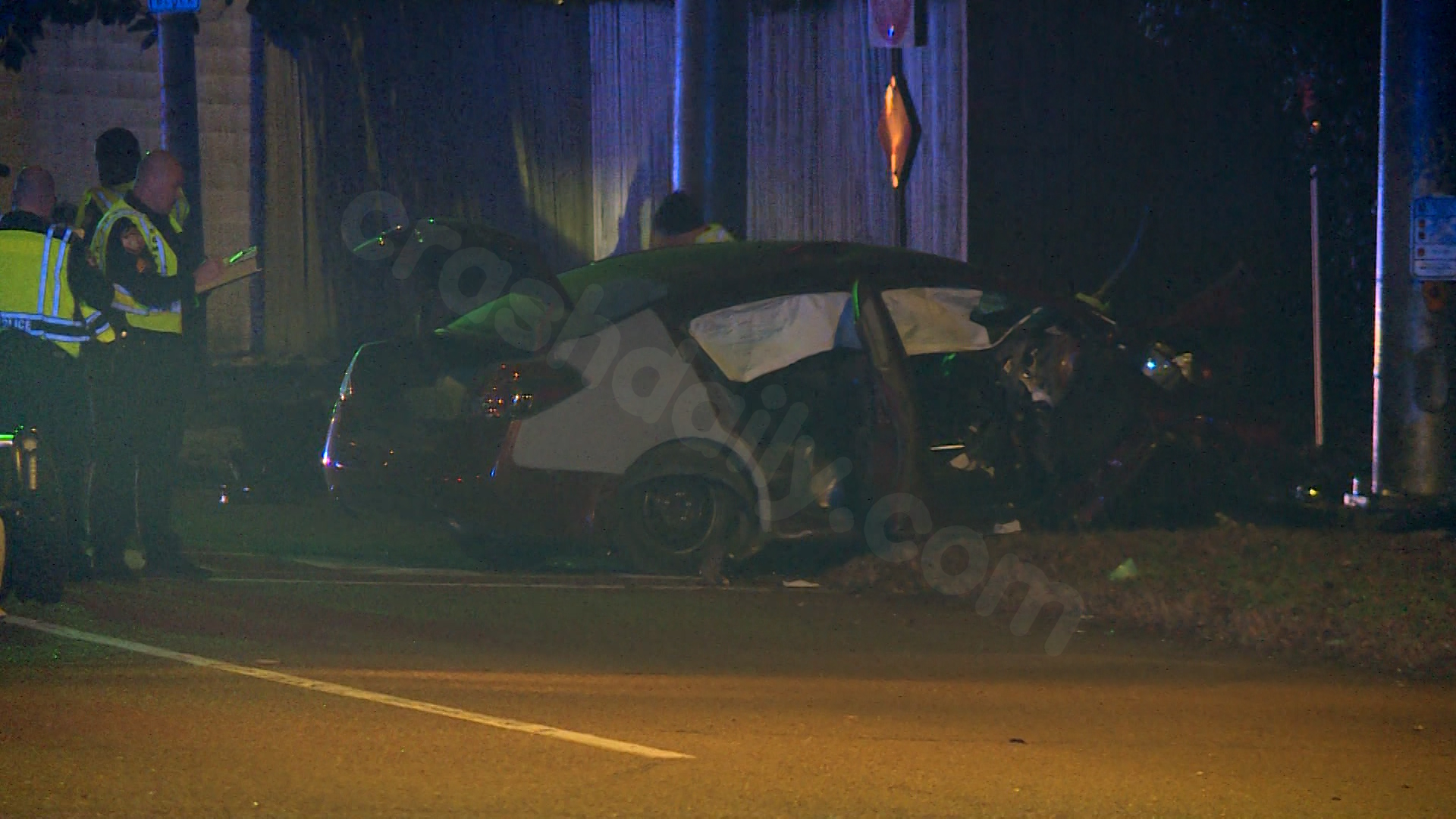 Fatal accident as vehicle hits curb and pole.