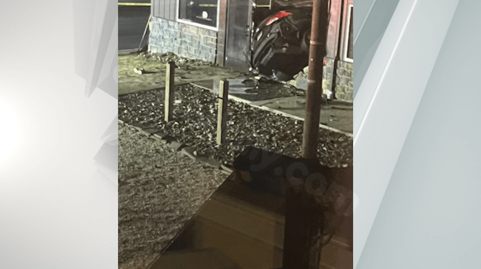 Car smashes into building following police pursuit in Adams County