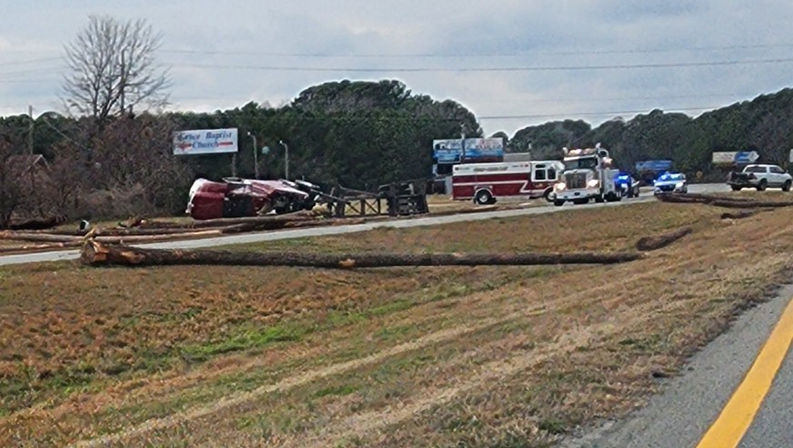Crash on US 70 in Johnston County causes log truck spill and Kia engine ejection, officials report