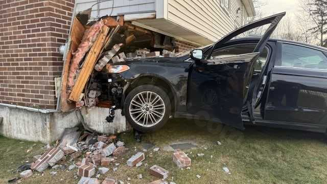 1 person hospitalized following car collision with Massachusetts residence
