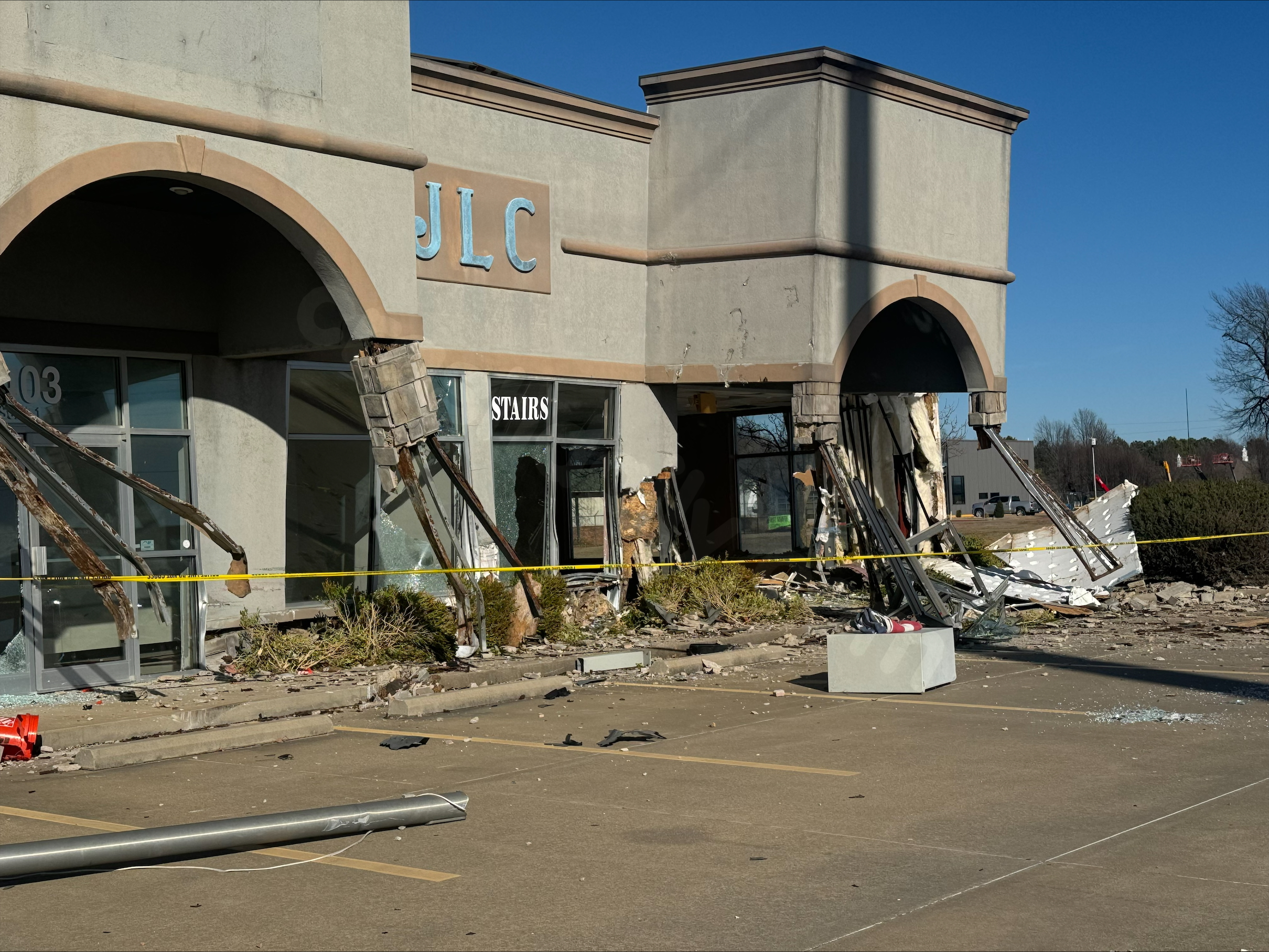 Vehicle collides with Rogers building, injuring 3