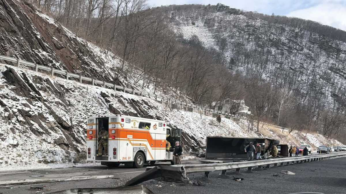 Photos of dump truck overturning while transporting stones