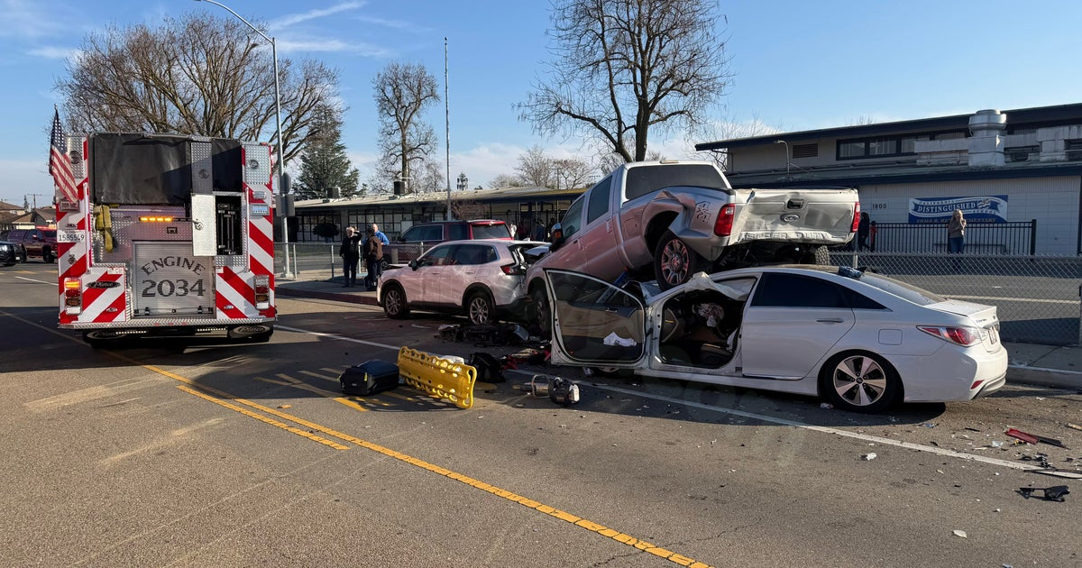 Injuries to adult and child in car collision at Lodi school.