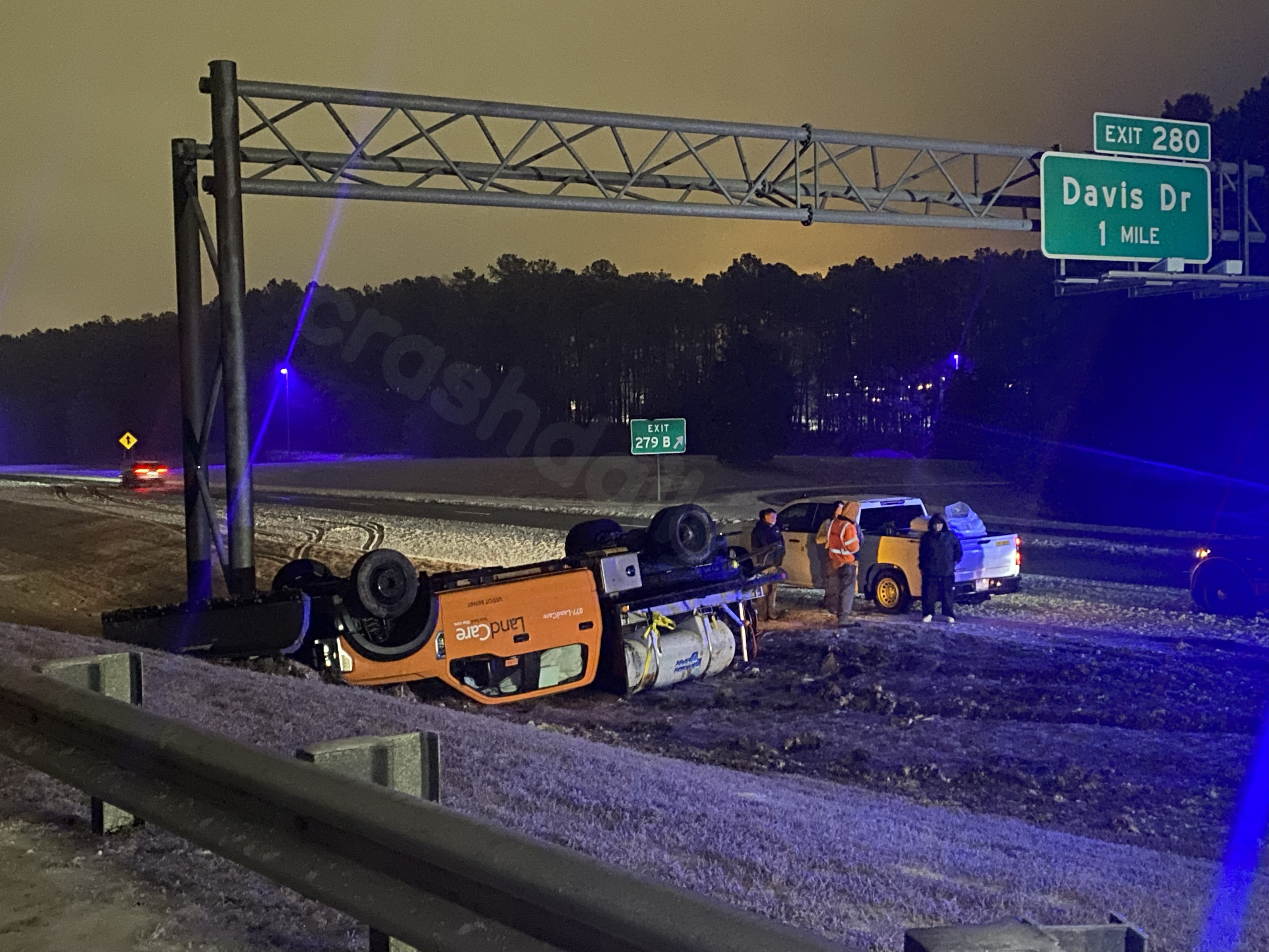 Brine truck overturns in Durham on icy roads across Triangle.