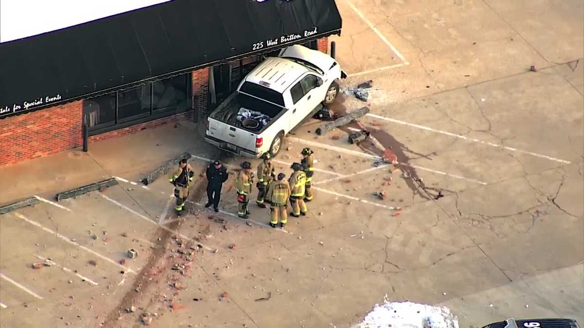 Truck collides with building in multi-vehicle crash in north OKC