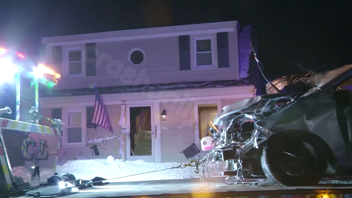 Mass. family shaken after car plows across lawn, into front door of home