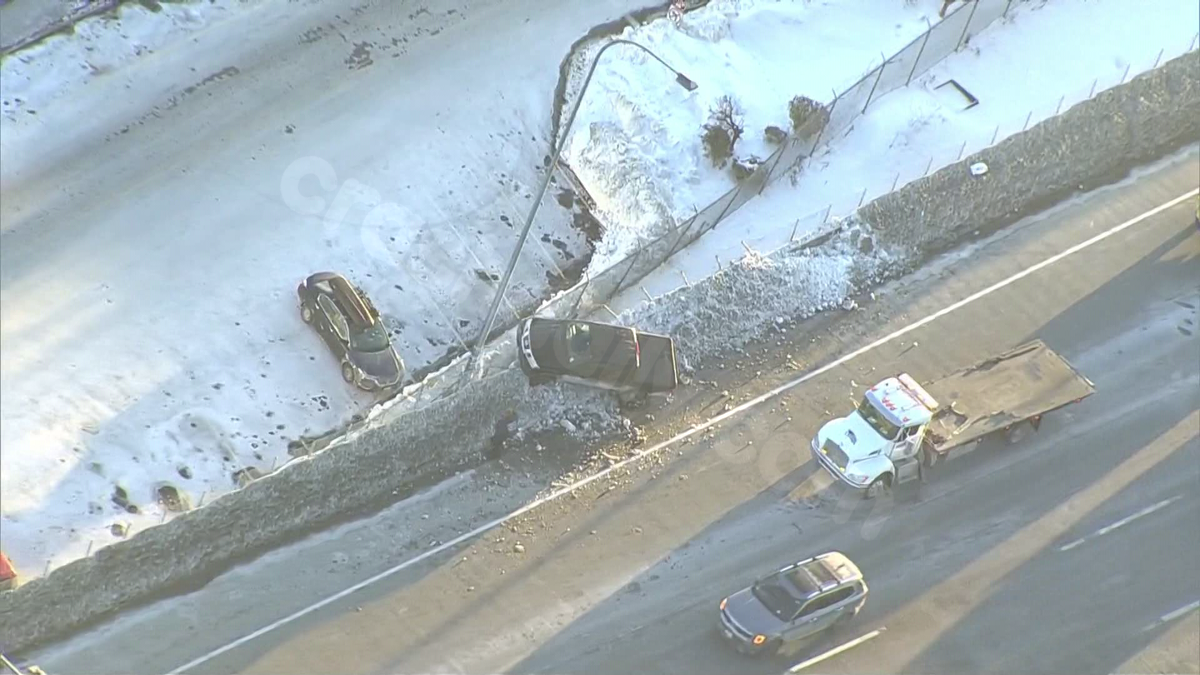 Truck left partially dangling over upper deck of I-93 after Boston crash