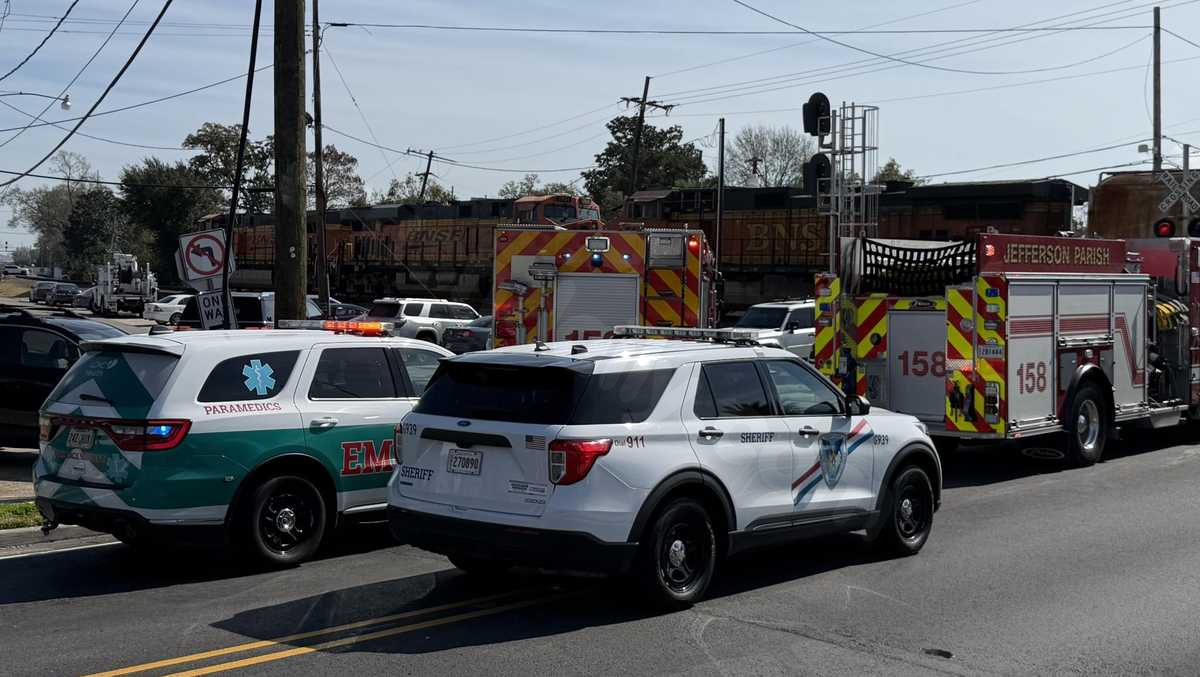 Authorities responding after train hits car at the Metairie Road crossing
