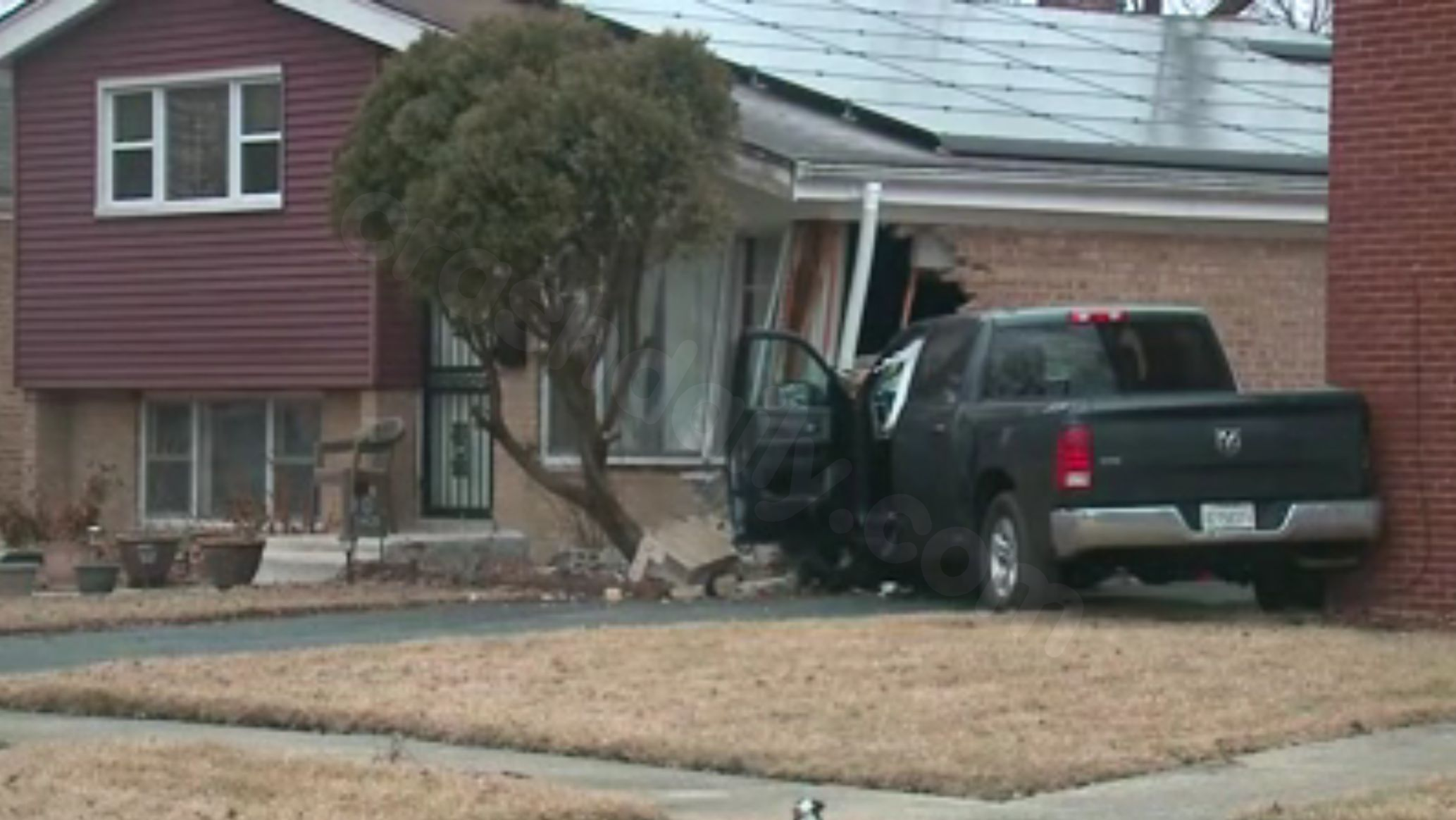 Homicide investigation underway after shooting victim crashes car into 2 homes in suburban Harvey